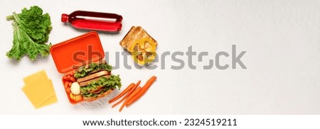 Lunch box and tasty food on light background with space for text