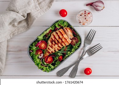 Lunch Boxes With Chicken And Salad, Ready To Go For Work Or School. Meal Preparation Or Dieting Concept. White Wooden Table. Top View