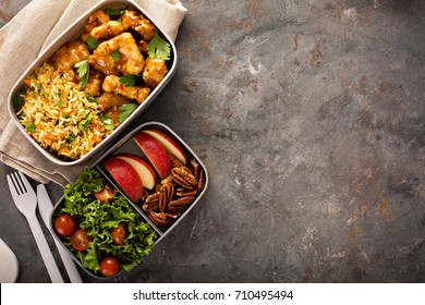 Lunch boxes with food ready to go for work or school, ahead meal preparation or dieting concept - Shutterstock ID 710495494