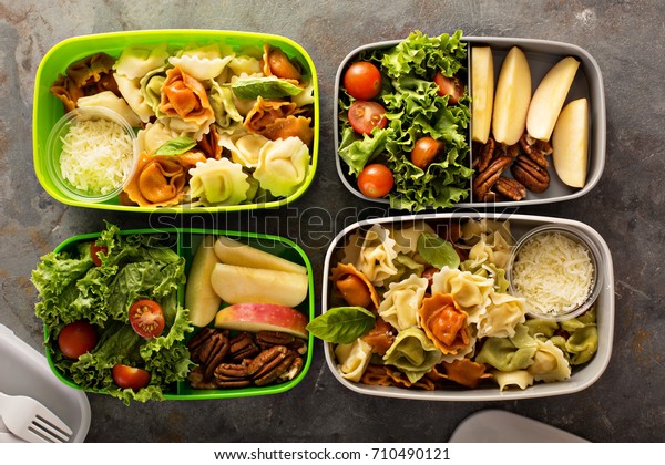 Lunch boxes with food\
ready to go for work or school, ahead meal preparation or dieting\
concept