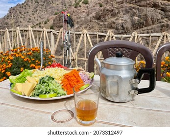 Lunch break on the Toubkal trek in Sidi Chamharouch. Delicious salad platter and mint tea. High Atlas Mountains, Morocco.