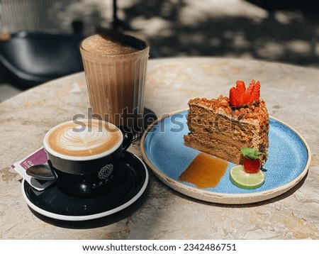 Lunch at the cafe with cake, coffee and cold chocolate