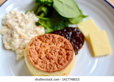 Lunch Cheese Soufflé With Relish, Sliced Cheddar Cheese And Salad