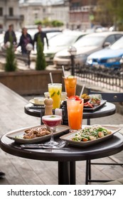 Lunch Dishes And Cocktails Served On The Table Street Food Cafe Summer Outside Side View