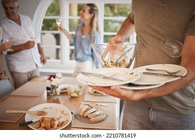 Lunch, Family And Man Cleaning Dishes From Table After Eating Meal. Clean Up, Packing Away And Clearing Plates From Dinner Table After Family Lunch Together. Household, Helping And Dinner At Home