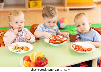 Lunch In Kindergarden. Babies Eating Healthy Food