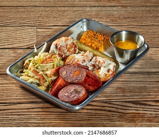 Lunch Set Of Sausage, Potato Croquettes With Creamy Dressing, Vegetable Salad, Pickles And Grilled Corn