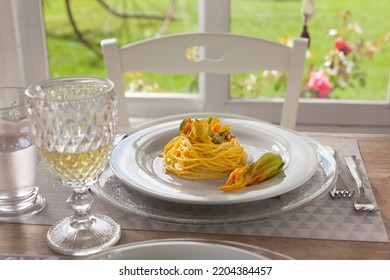 Lunch Set Table In A Bay Window With Zucchini Floers Spaghetti