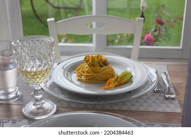 Lunch Set Table In A Bay Window With Zucchini Floers Spaghetti