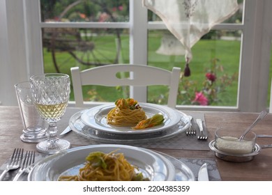 Lunch Set Table In A Bay Window With Zucchini Floers Spaghetti