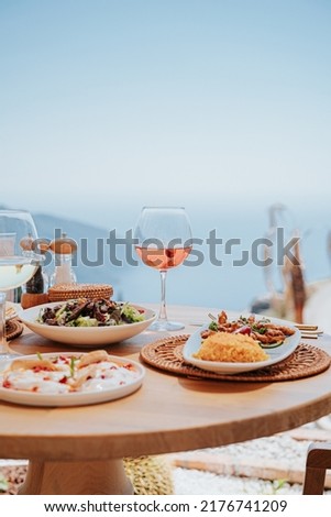 Lunch table with a sea view wine and food