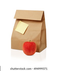 Lunch Time. Closeup Of Brown Paper Lunch Bag,red Apple  Isolated On White.