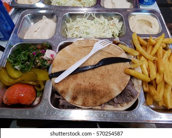 Lunch Time Meal In Lebanon. Pulled Meat, Tabouli, Chips, Hommus/ Hummus, Yogurt And Arabic Bread.