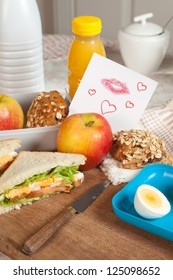 Lunchbox With A Love Note On The Breakfast Table