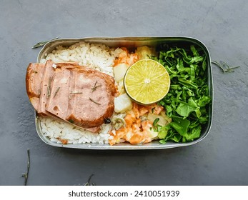 lunchbox in the pot with rice, salad, mayonnaise, and meat and  rustic background