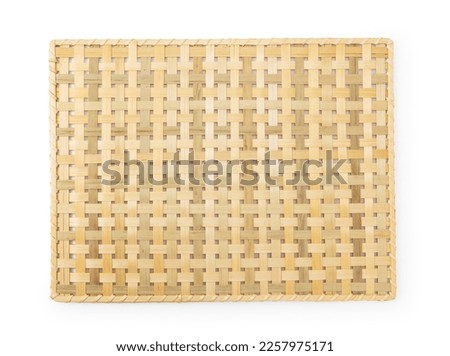Luncheon mat made of bamboo on a white background. Crafts. Asia.