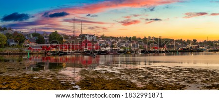 Lunenburg, Nova Scotia, Canada. Beautiful view of a historic port on the Atlantic Ocean Coast. Colorful Cloudy Sunrise Artistic Render. Panorama