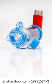 Lung Medication With Corticosteroids For Asthma Or COPD. An Inhaler With Spacer With White Background.