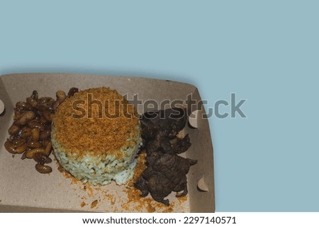 
lung rice, serundeng dishes, peanuts, on a blue background
