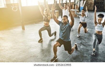 Lunge, group or people in gym with personal trainer for balance, fitness training or a healthy body. Women, men or coach instructor in exercise or workout for strong legs in wellness studio class - Powered by Shutterstock