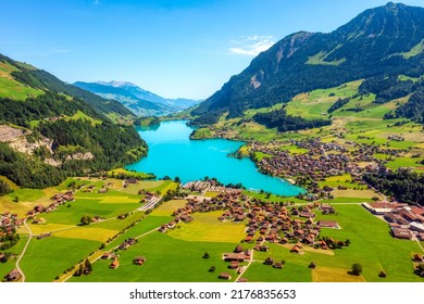 Lungern village on picturesque Lake Lungern, famous for its crystal clear water, in swiss Alps mountains valley, Obwalden canton, Switzerland