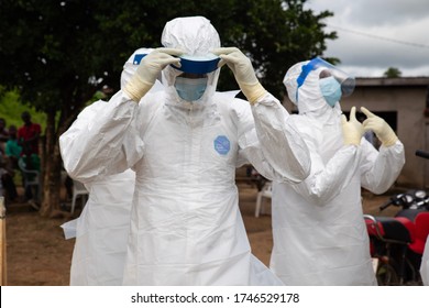 Lunsar, Sierra Leone - July 8, 2015: Buerial team members ready to take a body in a village. ebola response epidemic disease in Africa, ebola and corona virus context