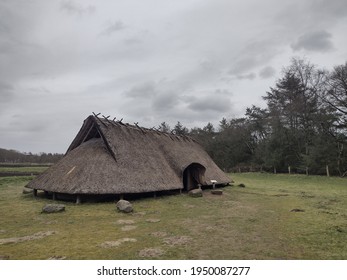 Lunteren, The Netherlands - March 28, 2021: Replica Of An Iron Age Farm House On A Celtic Field Near Lunteren. 