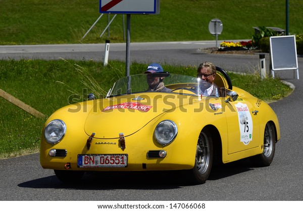 LUNZ, AUSTRIA - JULY 19: Porsche 356 Speedster on\
special stage by International Ennstal Classic 2013, a yearly\
tournament through Austria for vintage cars on July 19, 2013, in\
Lunz am See, Austria