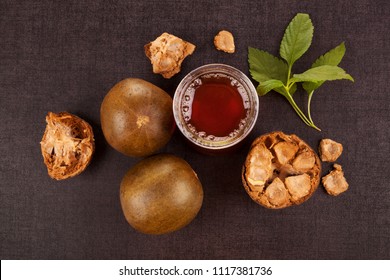 Luo Han Guo aka Monk fruit natural remedy on black background. Powerful healthy sweetener.
