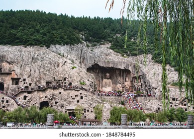 Luoyang, China, August 03, 2018: Longmen Buddhist cave temple complex, view of the rocks with caves and the river