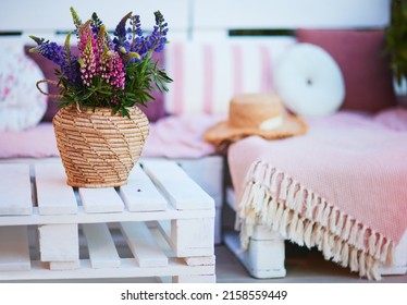 Lupine Flower Bouqet On The Wooden Pallet Furniture At Summer Patio Garden