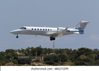 Luqa, Malta July 29, 2017: A private Learjet 45 [9H-BCP] coming in to land at midday.