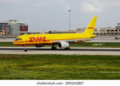 Luqa, Malta - November 23, 2016: DHL cargo plane at airport. Air freight and shipping. Aviation and aircraft. Transport industry. Global international transportation. Fly and flying.