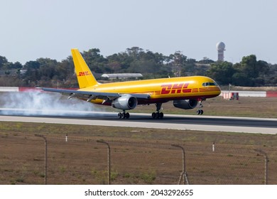 Luqa, Malta - September 16, 2021: DHL (European Air Transport - EAT) Boeing 757-28A(PCF) (REG: D-ALEV) touching down with a lot of rubber smoke.