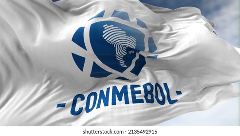 Luque, PAR, March 2022: close-up view of the White Flag with the CONMEBOL logo waving in the wind. CONMEBOL stands for South American Football Confederation. Illustrative editorial