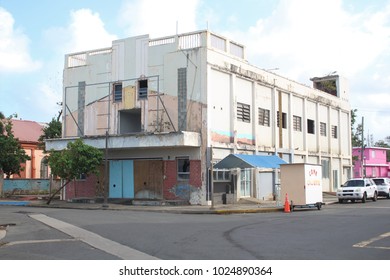 Luquillo Puerto Rico - February 12, 2018: A commercial building shows damage from Hurricanes Irma and Maria in February 2018 in Luquillo Puerto Rico.