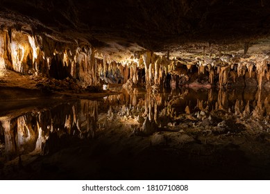 Luray Caverns, Luray Virginia 8/28/2020: Dream Lake of Luray Caverns displaying a perfect mirror image of stalactite formations on the water. 