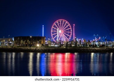 Lusail, Qatar - December 01, 2022: Ferris wheel, Lusail Winter Wonderland outdoor amusement park in Al Maha Island Night View - Shutterstock ID 2259916731