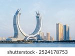 Lusail, Qatar- September, 10,2024: the newly developed lusail city with winter wonderland and crescent tower in the background.