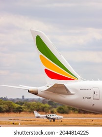 Lusaka, Zambia - November 3, 2012: Tail Of An Ethiopian Airlines Boeing 787-8 With A Beechcraft Baron 58.