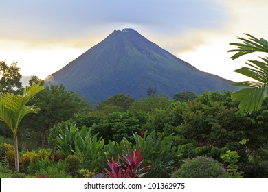 A lush garden in La Fortuna, Costa Rica with Arenal Volcano in the background - Shutterstock ID 101362975