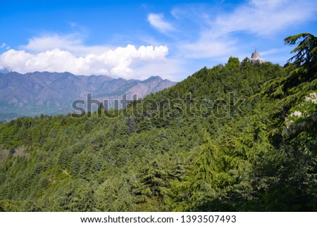 Lush green forest. Hindu temple on the top of hill.The temple is at a height of 1,000 feet above the plain and overlooks the city of Srinagar. Shankaracharya temple is hindu temple.