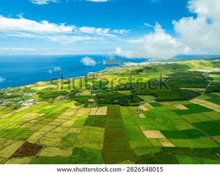 Lush Green Patchwork Fields, Pasturelands on Sunny Day. Atlantic Ocean. Terceira Island, Azores, Portugal. Aerial View