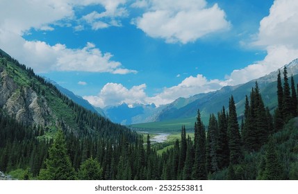 Lush green valley with flowing river, framed by towering pine trees. Snow-capped mountains peek beneath a vibrant blue sky dotted with fluffy clouds. - Powered by Shutterstock