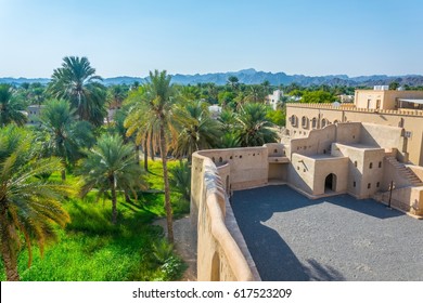 Lush Oasis Surrounding The Nizwa Fortress In Oman.