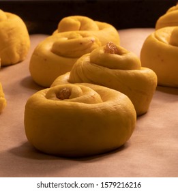 Lussekatt Close Up. Traditional Swedish Christmas Food. Saffron Flavored Dough With Raisins. Saffron Buns