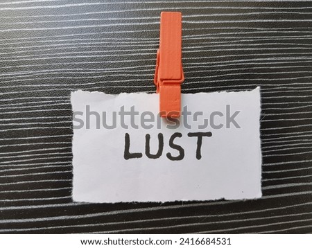 lust writing on table background.