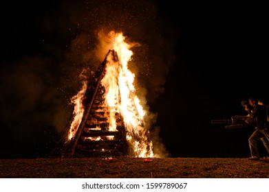 Lutcher, LA / United States - 12 24 2019: Annual Christmas Bonfires A Cajun Tradition Along Mississippi River Levee Guiding Papa Noel