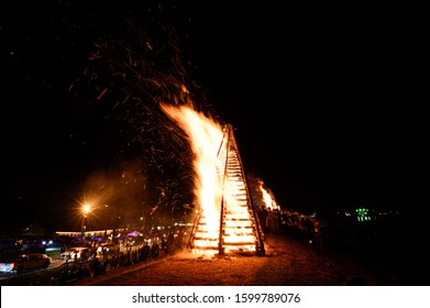 Lutcher, LA / United States - 12 24 2019: Annual Christmas Bonfires A Cajun Tradition Along Mississippi River Levee Guiding Papa Noel