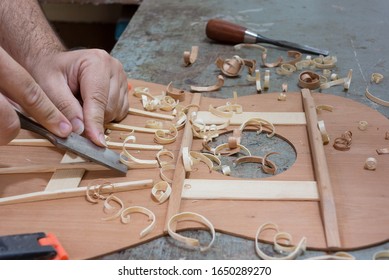 Luthier Making Top Of Guitar